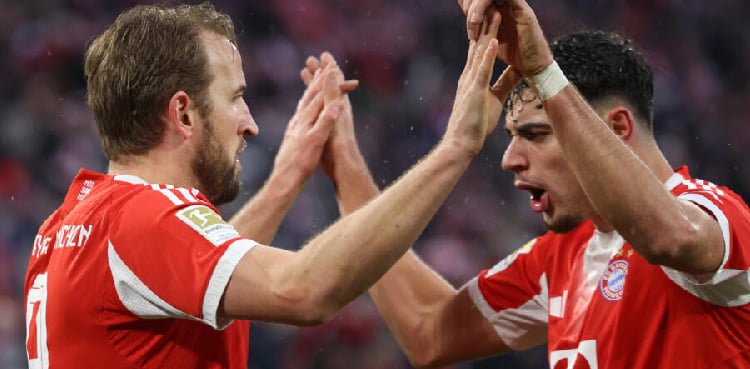 Kane helps Bayern extend Bundesliga lead as Dortmund held by Leipzig