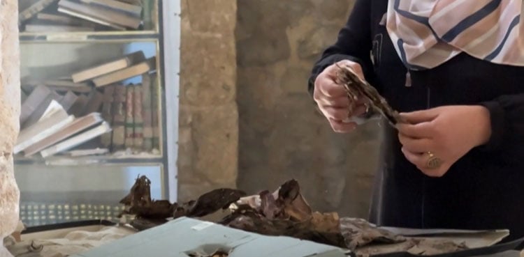 Gazans salvage ancient books in mosque library damaged by war