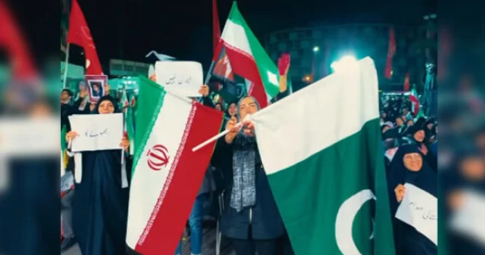 Iranians raise Pakistani flags at massive Tehran rally to honor public support