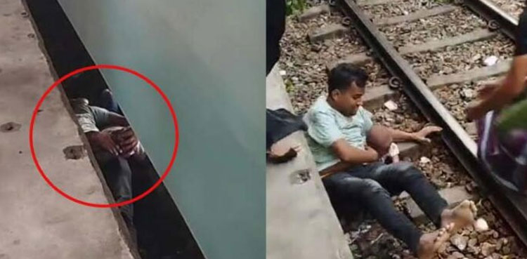 Viral Video: Father saves child after fall under moving train