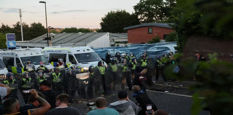 British PM urges calm after protests over handcuffed student’s death