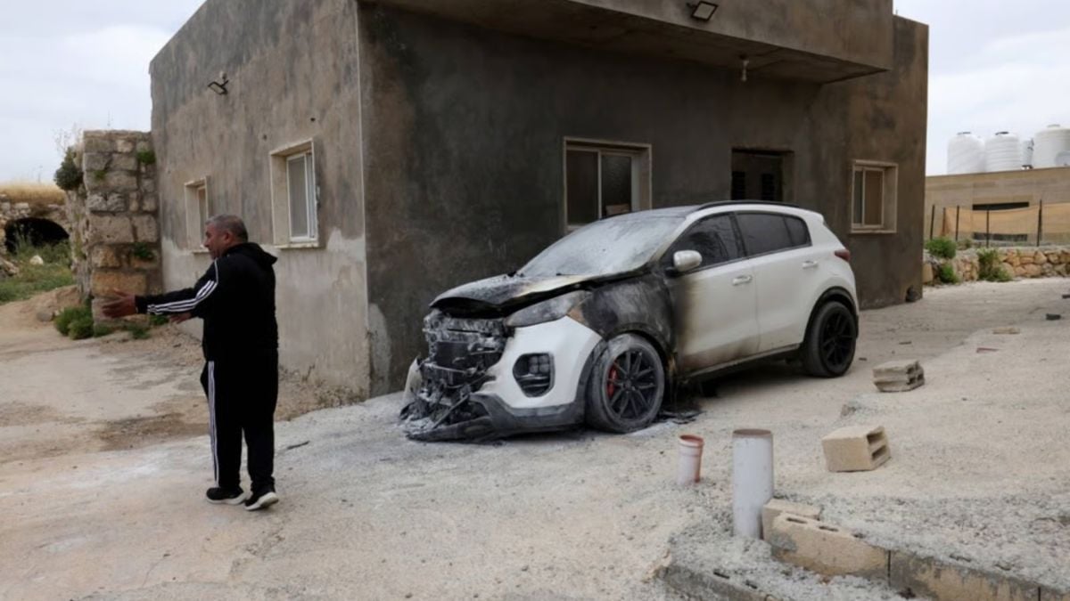 Palestinians say Israeli settlers torch mosque, factory