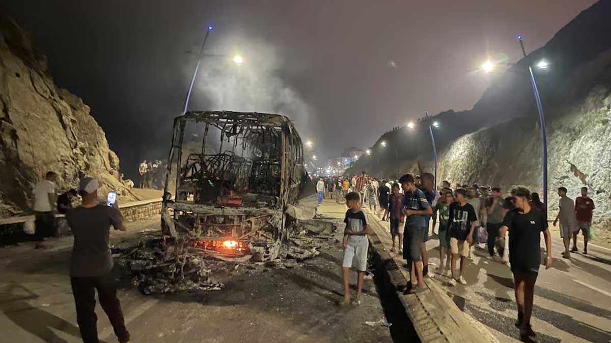 Sleepless night near border of Spain’s Ceuta as migrants torch vehicles